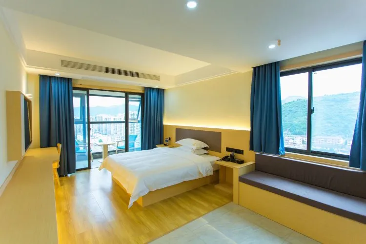 Room comfort and ocean light in a casino-resort bedroom